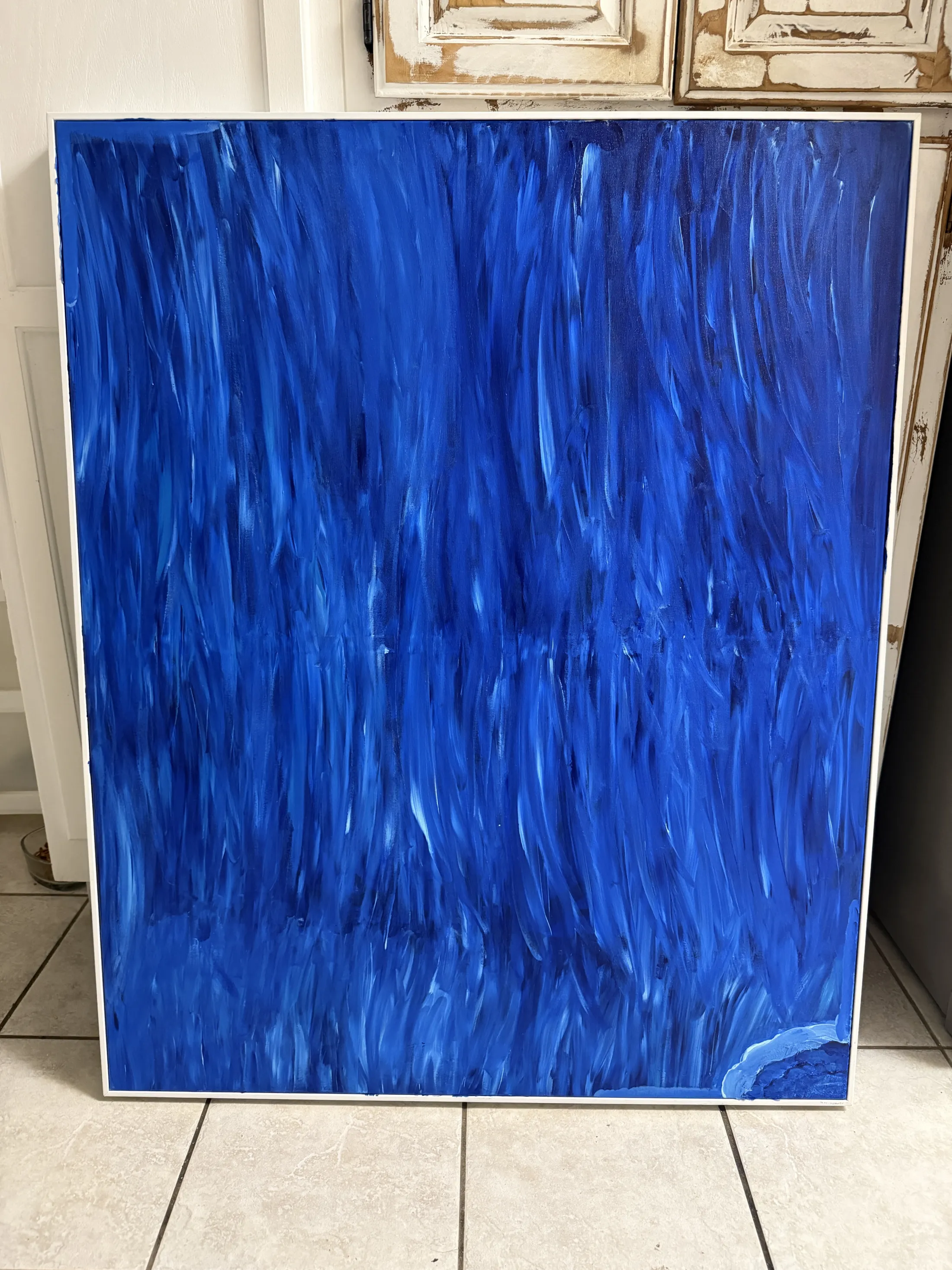 Blue abstract canvas artwork in progress for an upcoming project
